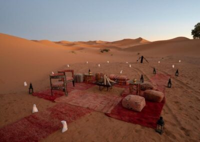 Camel caravan crossing the dunes of Merzouga at sunset, a breathtaking endpoint on an Atlas itinerary.