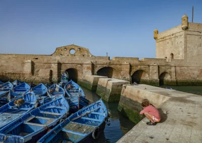 Historic medina walls and fishing boats in Essaouira with Atlantic Ocean view Atlas itinerary,