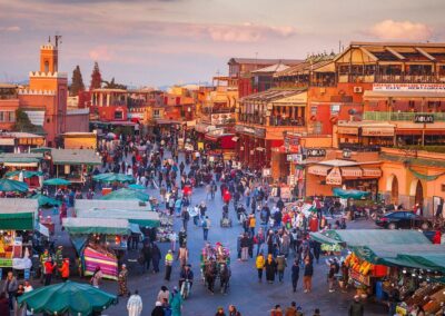 View of Marrakech’s medina with the Atlas Mountains in the distance, highlighting a stop on an Atlas itinerary.
