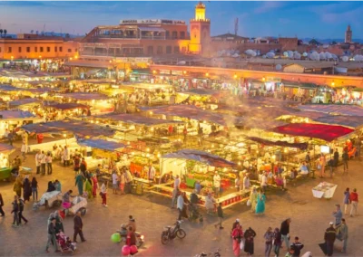 View of Marrakech’s medina with the Atlas Mountains in the distance, highlighting a stop on an Atlas itinerary.