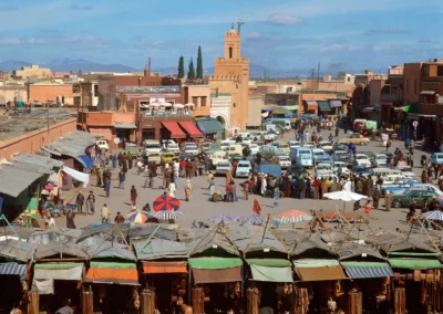 View of Marrakech’s medina with the Atlas Mountains in the distance, highlighting a stop on an Atlas itinerary.