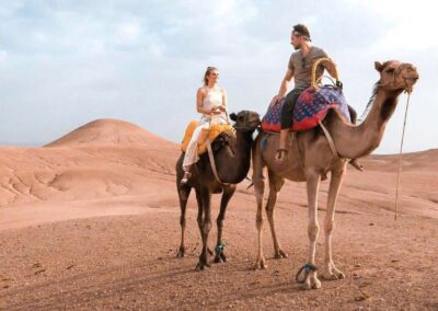 Scenic view of Agafay Desert with the Atlas Mountains in the distance, an accessible desert stop on an Atlas itinerary.
