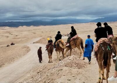 Scenic view of Agafay Desert with the Atlas Mountains in the distance, an accessible desert stop on an Atlas itinerary.